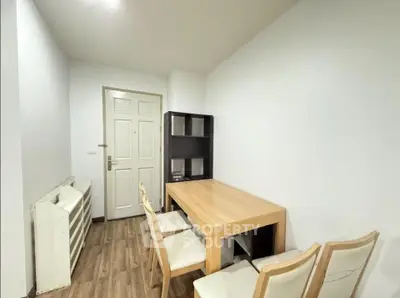 Modern study room with wooden table and chairs, minimalist design, perfect for productivity.