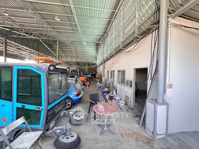Spacious industrial warehouse with high ceilings and ample storage space.
