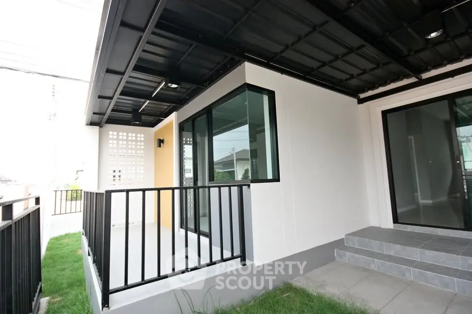 Modern home exterior with sleek design and spacious balcony