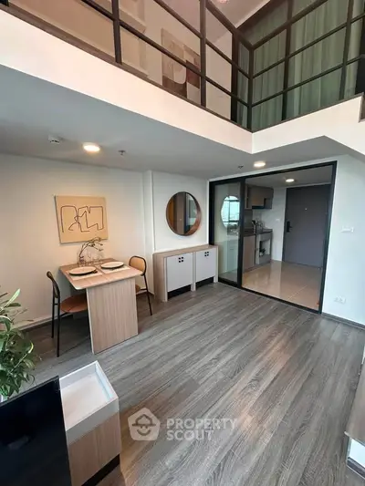 Modern loft-style living room with open kitchen and stylish decor