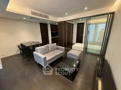 Modern living room with sleek furniture and open layout in a stylish apartment.