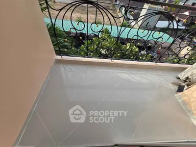 Charming balcony with elegant railing and scenic view, perfect for relaxation.