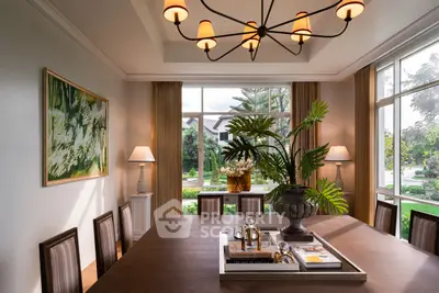 Elegant dining room with large windows and stylish decor, offering a serene garden view.