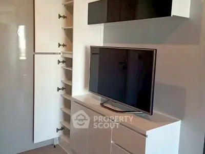 Modern living room with sleek TV unit and ample storage space