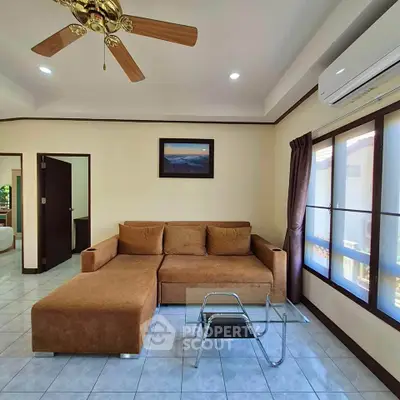 Spacious living room with cozy brown sofa and modern decor