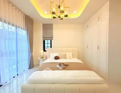 Luxurious bedroom with elegant lighting and spacious wardrobe in modern apartment