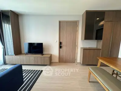 Modern living room with sleek wooden furniture and flat-screen TV, perfect for stylish urban living.