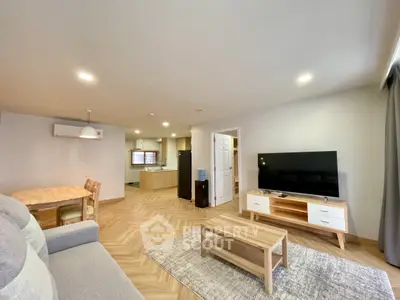 Spacious modern living room with open kitchen and stylish furniture