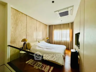 Luxurious bedroom with modern decor and natural light