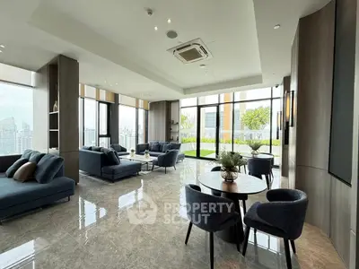Luxurious modern living room with panoramic city views and elegant furnishings.