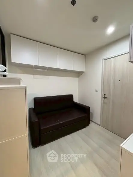 Compact living room with modern furniture and storage solutions