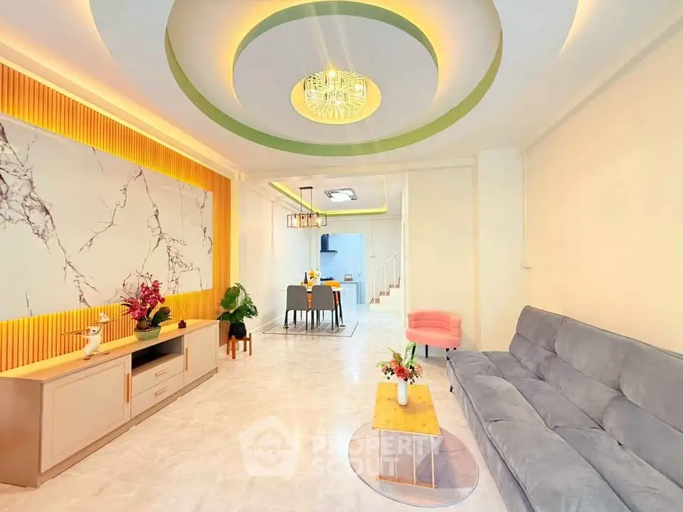 Spacious modern living room with elegant ceiling design and stylish furniture