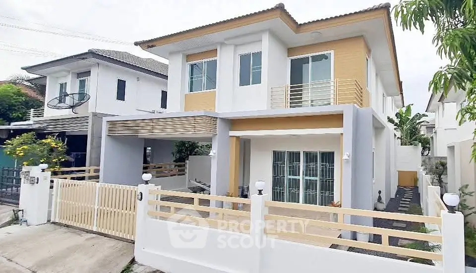 Modern two-story house with spacious driveway and stylish exterior design