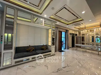 Luxurious modern living room with elegant marble flooring and mirrored accents