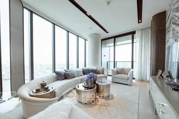 Luxurious modern living room with panoramic city views and elegant furnishings.
