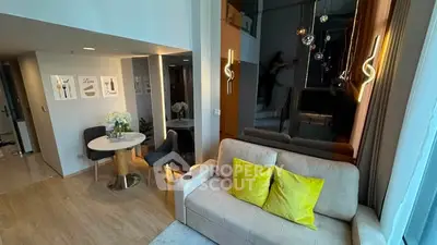 Modern living room with stylish decor and cozy seating area in a contemporary apartment.