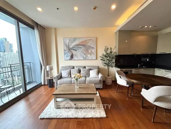 Modern living room with elegant decor and city view balcony in luxury apartment.