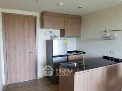 Modern kitchen with sleek wooden cabinets and compact design