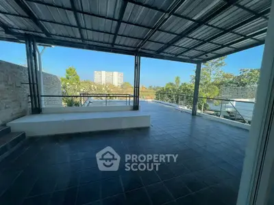 Spacious covered balcony with modern design and scenic view