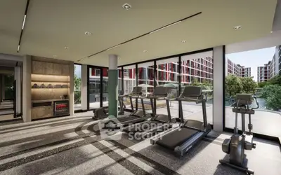 Modern gym with treadmills and large windows overlooking a scenic view in a luxury apartment complex.