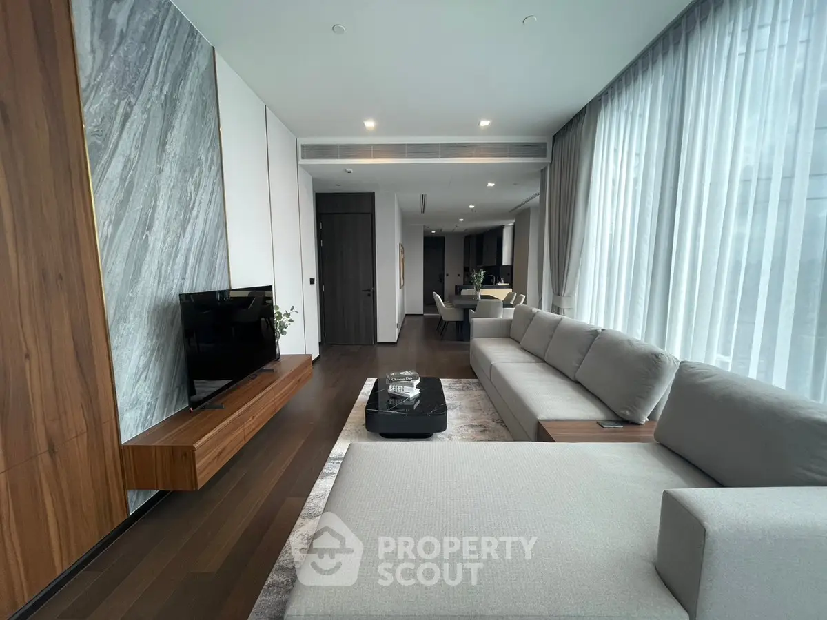 Luxurious modern living room with sleek design and large windows