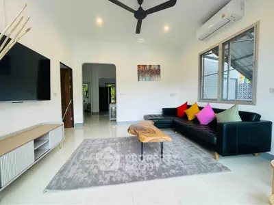 Modern living room with stylish decor and colorful cushions