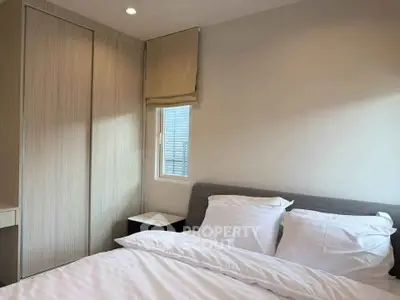 Cozy bedroom with modern design and ample natural light