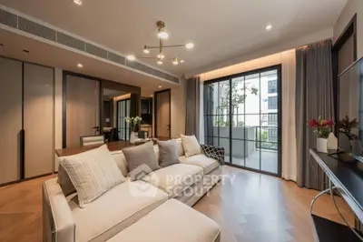 Luxurious living room with elegant decor and spacious balcony view