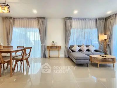 Spacious modern living room with elegant decor and natural light