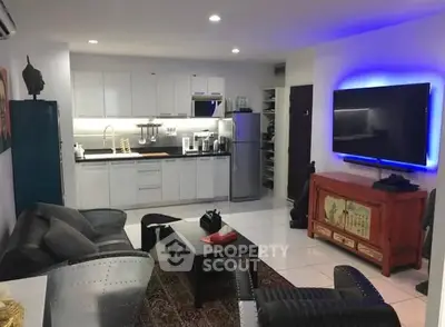 Modern living room with open kitchen and stylish decor