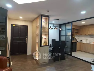 Modern open-plan living room with stylish kitchen and dining area