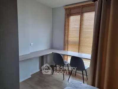 Modern study nook with natural light and sleek design, perfect for productivity and comfort.