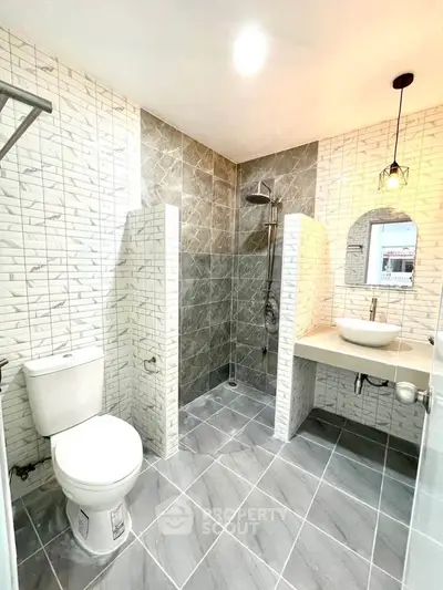 Modern bathroom with stylish tiles and elegant fixtures