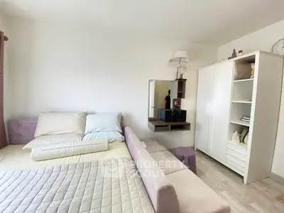 Cozy bedroom with modern decor and ample storage space