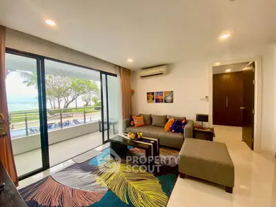 Spacious living room with modern decor and balcony overlooking scenic view