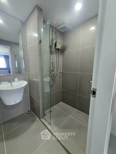 Modern bathroom with sleek shower and elegant tile design