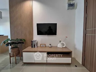 Modern living room with sleek TV stand and minimalist decor