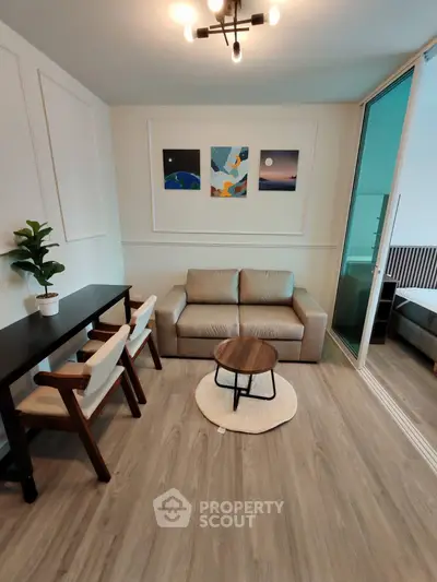 Modern living room with stylish decor and cozy seating area, perfect for relaxation and entertaining.