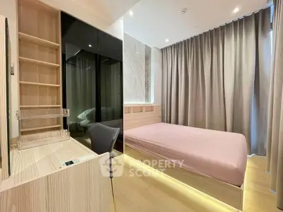 Modern bedroom with sleek design, featuring a cozy bed, stylish desk, and ample storage space.