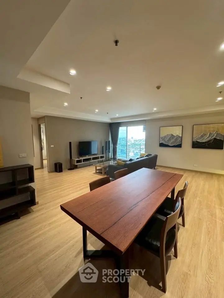 Spacious modern living room with wooden flooring and elegant decor