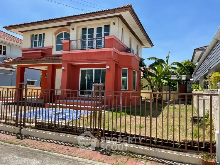 Charming two-story house with spacious front yard and balcony in a serene neighborhood.