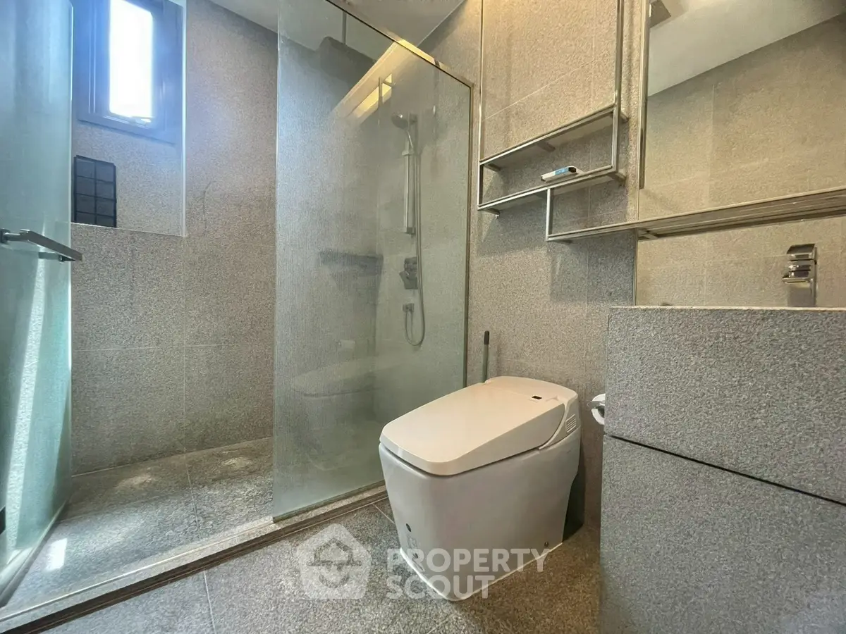 Modern bathroom with sleek design and glass shower enclosure