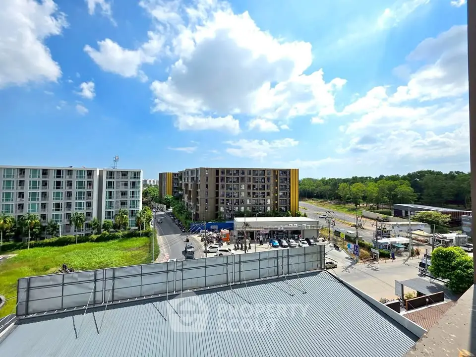 Stunning view of modern apartment buildings with lush greenery and clear blue skies.