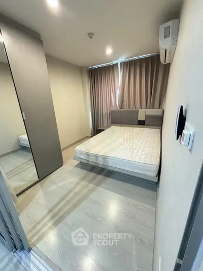 Modern bedroom with minimalist design and ample natural light