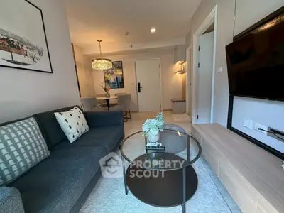 Modern living room with stylish decor and open dining area