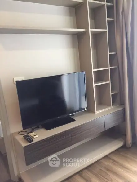 Modern living room with sleek TV unit and stylish shelving