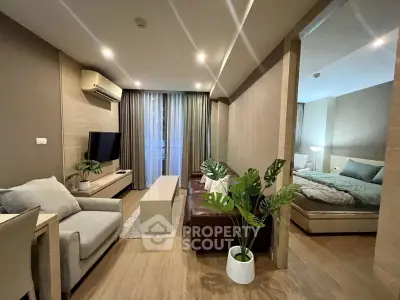 Modern living room with open layout and stylish decor in a cozy apartment.