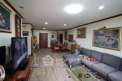 Spacious living room with modern decor and cozy seating area