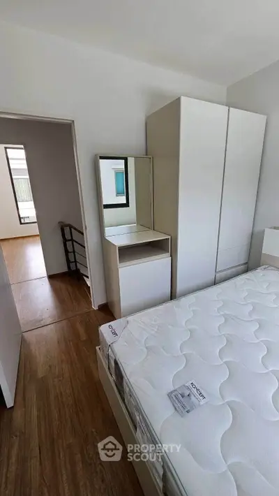 Modern bedroom with minimalist furniture and natural light