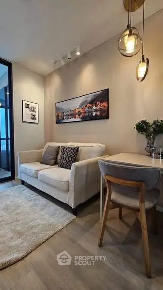 Cozy living room with modern decor and elegant lighting, perfect for relaxation and entertaining.